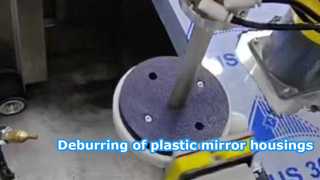 2Robot for precise and efficient removal of burrs and gate marks from plastic mirror housings